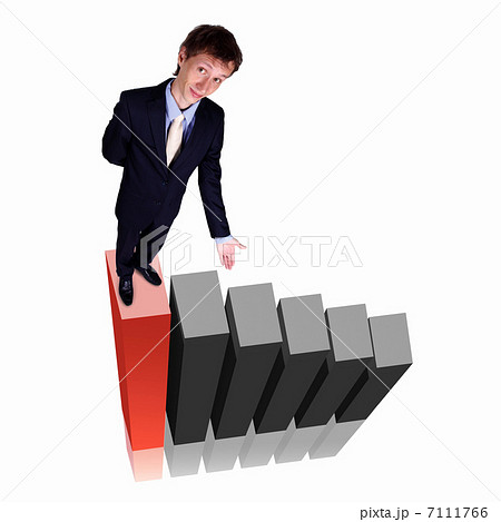 Businessman on Top of financial charts Businessman on Top of financial charts 7111766