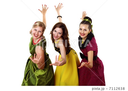 three young woman in bright colour dresses three young woman in bright colour dresses 7112638