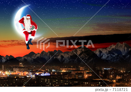 photo of santa claus sitting on the moon 7118721