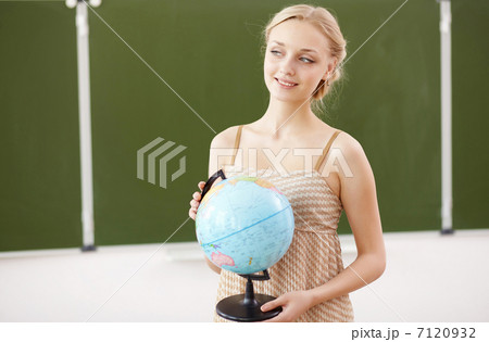 Teacher at school with a globe 7120932