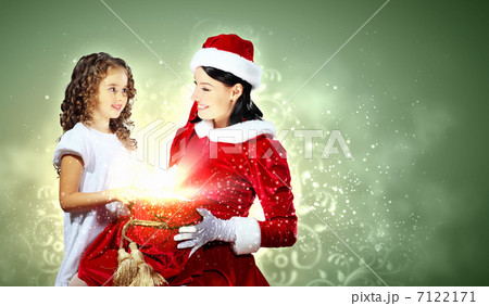 Little girl with christmas gifts and santa Little girl with christmas gifts and santa 7122171
