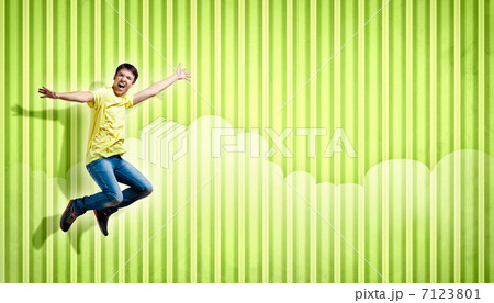 young woman dancing and jumping... 7123801