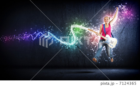 young woman playing on electro guitar and jumping young woman playing on electro guitar and jumping 7124365