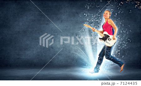 young woman playing on electro guitar and jumping young woman playing on electro guitar and jumping 7124435