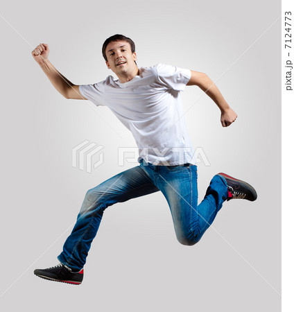 Young man dancing and jumping Young man dancing and jumping 7124773