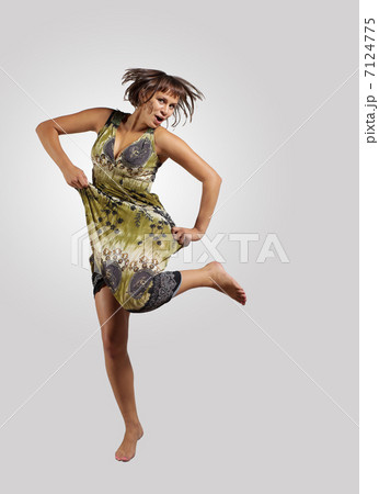 young woman dancing and jumping... young woman dancing and jumping... 7124775