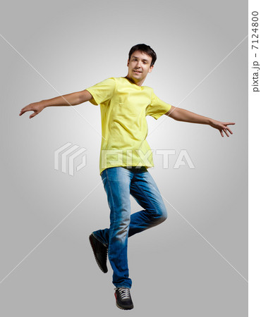 Young man dancing and jumping Young man dancing and jumping 7124800
