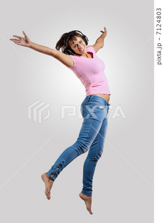 young woman dancing and jumping 7124803