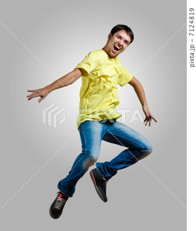 Young man dancing and jumping 7124819