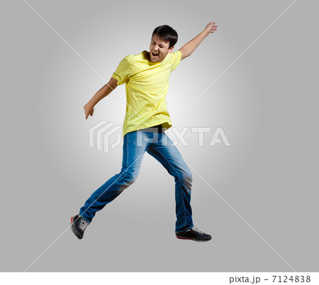 Young man dancing and jumping Young man dancing and jumping 7124838