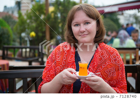 Girl drinking orange tea in Istanbul Girl drinking orange tea in Istanbul 7128740