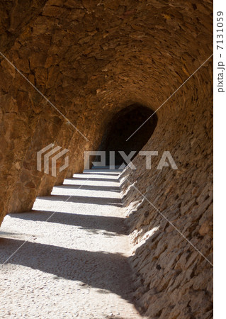 Arcade of stone columns in Park Guell, Gaudi 7131059