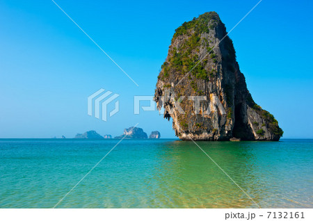 Tropical beach landscape with rock formation island and ocean 7132161