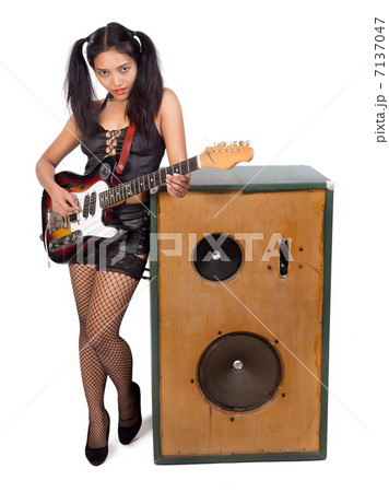 rock musician with a large speaker rock musician with a large speaker 7137047