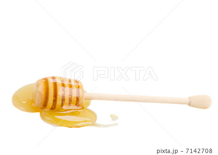 wooden honey stick in puddle wooden honey stick in puddle 7142708