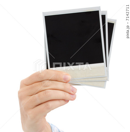hand holding instant photo hand holding instant photo 7142711
