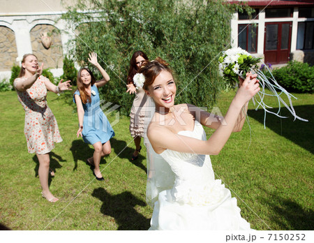 Young bride in white wedding dress 7150252