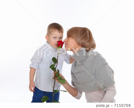 mother and son holding a red rose 7150709