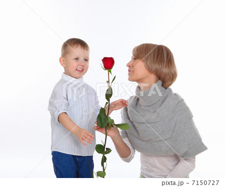 mother and son holding a red rose mother and son holding a red rose 7150727