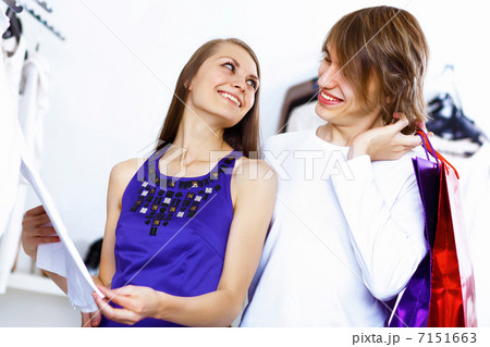 Young couple doing shopping together Young couple doing shopping together 7151663