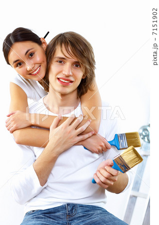 Young couple with paint brushes together Young couple with paint brushes together 7151902
