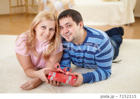 man at home with a present 7152215