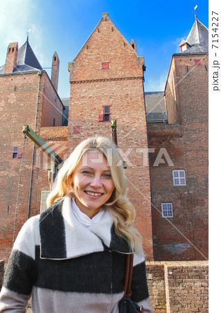 Girl on tour in the Dutch castle Loevestein. Netherlands Girl on tour in the Dutch castle Loevestein. Netherlands 7154227