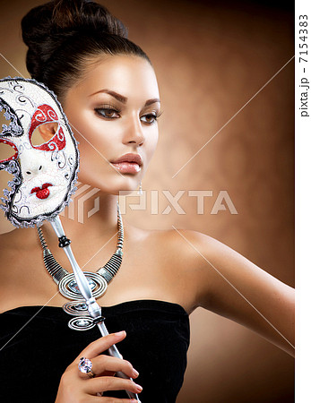 Masquerade. Beauty Girl with Carnival Mask Masquerade. Beauty Girl with Carnival Mask 7154383