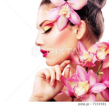 Beauty Portrait. Beautiful Stylish Girl with Orchid Flower 7154391