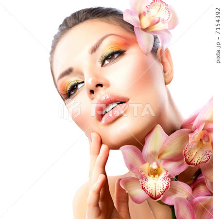 Beautiful Spa Girl With Orchid Flowers Isolated on White 7154392