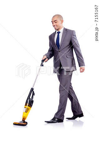 Businessman doing vacuum cleaning on white Businessman doing vacuum cleaning on white 7155167