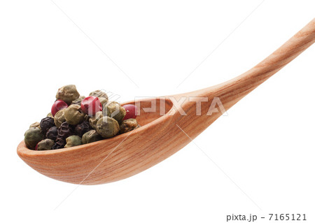 Pepper seasoning mix in wooden spoon isolated on white backgrou Pepper seasoning mix in wooden spoon isolated on white backgrou 7165121