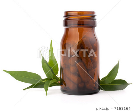 Herbal drug capsules in brown glass bottle. Alternative medicine Herbal drug capsules in brown glass bottle. Alternative medicine 7165164