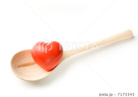 Spoon and heart on white background 7173343