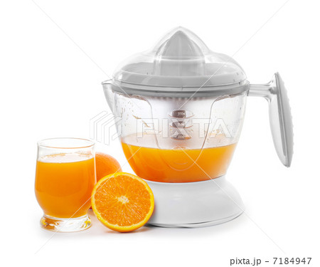 juice extractor with juice and ripe oranges 7184947