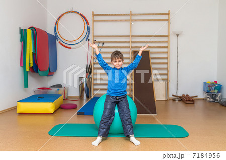 Child is therapeutic exercises in the gym Child is therapeutic exercises in the gym 7184956