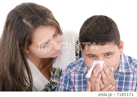 Child blowing nose. Child with tissue. catarrh or allergy 7185171