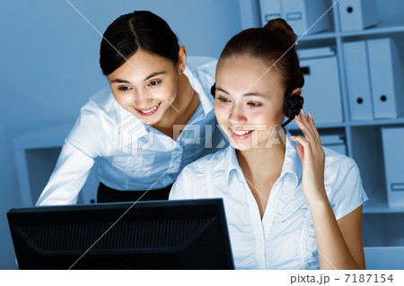 Young woman in business wear and headset 7187154