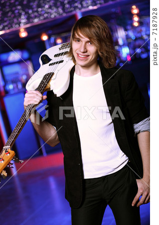 Young guitar player performing in night club Young guitar player performing in night club 7187928
