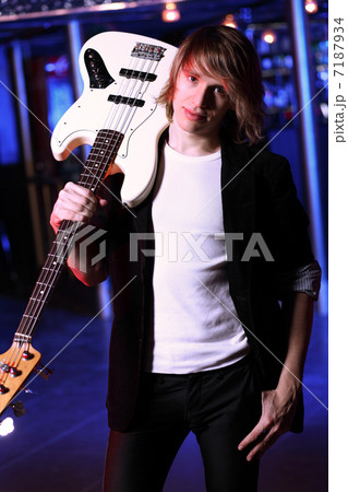 Young guitar player performing in night club Young guitar player performing in night club 7187934