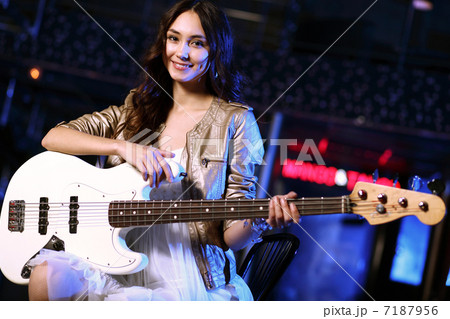 Young guitar player performing in night club Young guitar player performing in night club 7187956