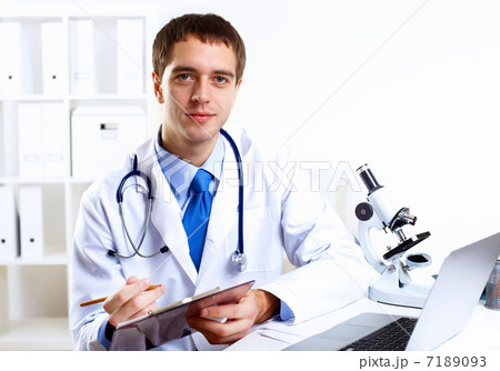 Friendly doctor in medical office Friendly doctor in medical office 7189093