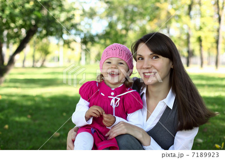 Mother with her daughter in summer park 7189923