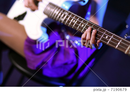 Young guitar player performing in night club Young guitar player performing in night club 7190679