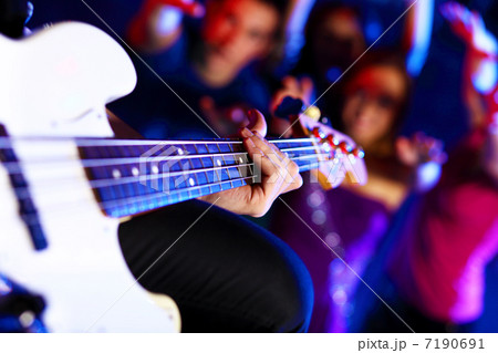 Young guitar player performing in night club Young guitar player performing in night club 7190691
