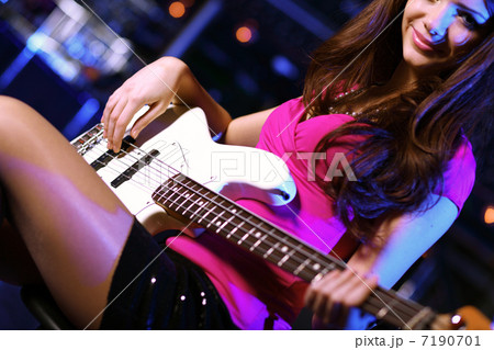 Young guitar player performing in night club Young guitar player performing in night club 7190701
