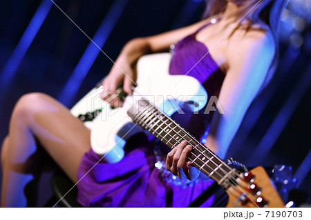 Young guitar player performing in night club Young guitar player performing in night club 7190703