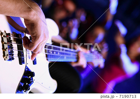 Young guitar player performing in night club 7190713