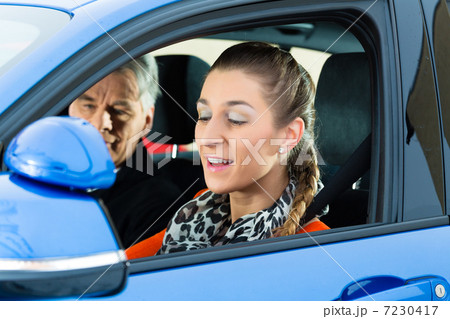 Young woman at driving lesson 7230417