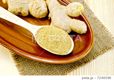 Ginger fresh and dried on a clay plate and burlap 7240596